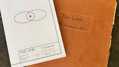 The published paperback of THE LINK beside the original typescript&rsquo;s hand-lettered red folder